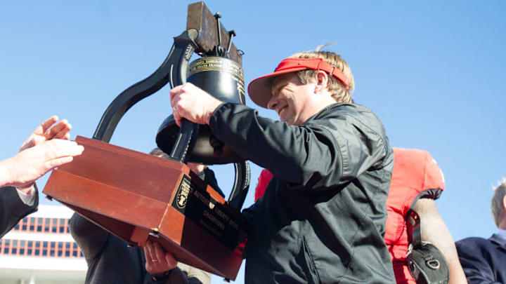 MEMPHIS, TN - DECEMBER 30: Head coach Kirby Smart of the Georgia Bulldogs lifts up the Liberty Bowl Trophy after they defeated the TCU Horned Frogs at Liberty Bowl Memorial Stadium on December 30, 2016 in Memphis, Tennessee. The Georgia Bulldogs defeated the TCU Horned Frogs 31-23. (Photo by Michael Chang/Getty Images)