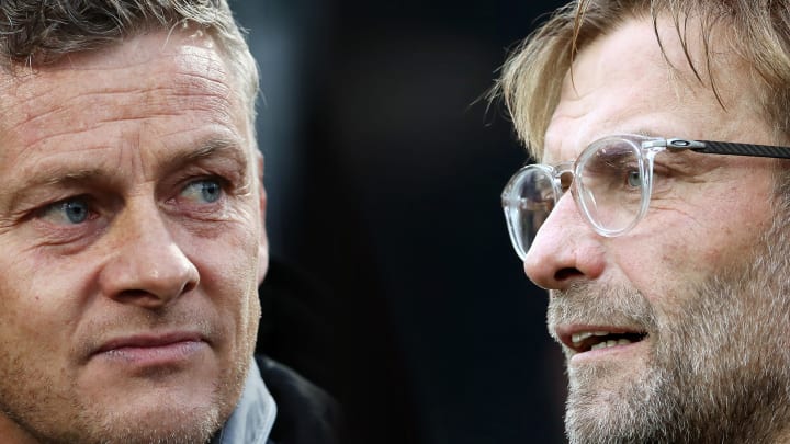 FILE PHOTO (EDITORS NOTE: COMPOSITE OF IMAGES – Image numbers 1178800802,856402376 – GRADIENT ADDED) In this composite image a comparison has been made between Ole Gunnar Solskjaer, Manager of Manchester United (L) and Liverpool manager Jurgen Klopp. Manchester United and Liverpool FC meet in the Premier League fixture on October 18, 2019 at Old Trafford in Manchester. ***LEFT IMAGE*** THE HAGUE, NETHERLANDS – OCTOBER 03: Ole Gunnar Solskjaer, Manager of Manchester United looks on prior to the UEFA Europa League group L match between AZ Alkmaar and Manchester United at ADO Den Haag on October 03, 2019 in The Hague, Netherlands. (Photo by Bryn Lennon/Getty Images) ***RIGHT IMAGE*** NEWCASTLE UPON TYNE, ENGLAND – OCTOBER 01: Liverpool manager Jurgen Klopp looks on during the Premier League match between Newcastle United and Liverpool at St. James Park on October 1, 2017 in Newcastle upon Tyne, England. (Photo by Ian MacNicol/Getty Images)