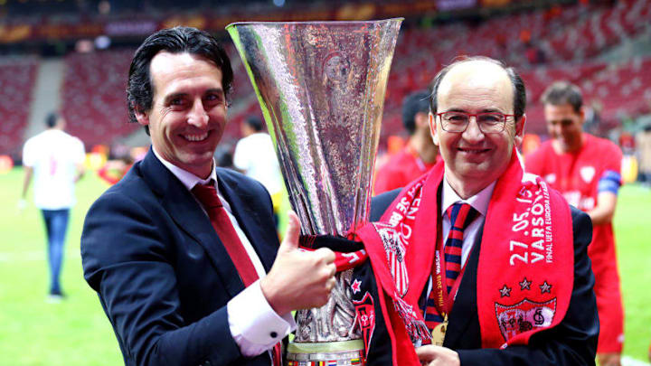 WARSAW, POLAND - MAY 27: Unai Emery (L), coach of Sevilla poses with Sevilla President Jose Castro and the trophy after the UEFA Europa League Final match between FC Dnipro Dnipropetrovsk and FC Sevilla on May 27, 2015 in Warsaw, Poland. (Photo by Martin Rose/Getty Images)