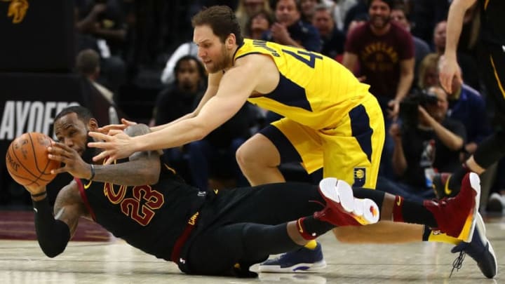 CLEVELAND, OH - APRIL 29: LeBron James #23 of the Cleveland Cavaliers dives for the ball in front of Bojan Bogdanovic #44 of the Indiana Pacers during the second half in Game Seven of the Eastern Conference Quarterfinals during the 2018 NBA Playoffs at Quicken Loans Arena on April 29, 2018 in Cleveland, Ohio. Cleveland won the game 105-101 to win there series. NOTE TO USER: User expressly acknowledges and agrees that, by downloading and or using this photograph, User is consenting to the terms and conditions of the Getty Images License Agreement. (Photo by Gregory Shamus/Getty Images)