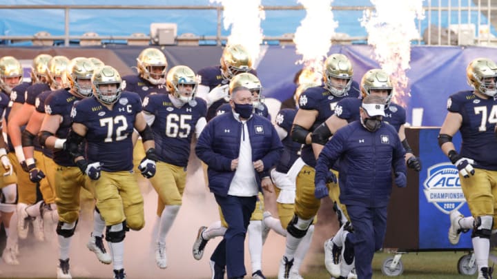 CHARLOTTE, NORTH CAROLINA - DECEMBER 19: The Notre Dame Fighting Irish run onto the field before the ACC Championship game against the Clemson Tigers at Bank of America Stadium on December 19, 2020 in Charlotte, North Carolina. (Photo by Jared C. Tilton/Getty Images)