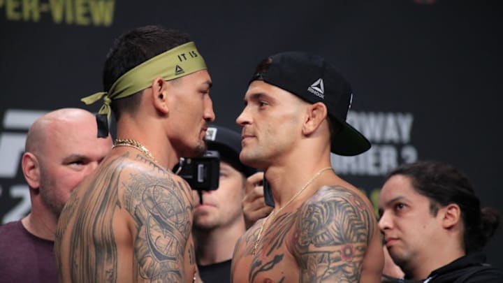 Max Holloway and Dustin Poirier face off at the UFC 236 ceremonial weigh-ins on Friday, April 12, 2019 (photo by Amy Kaplan)