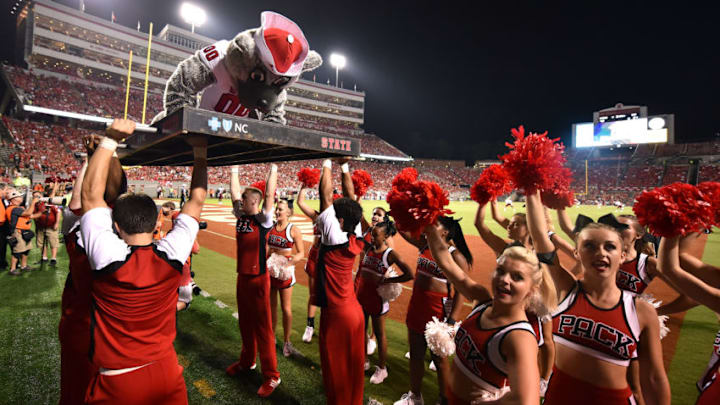 RALEIGH, NC - SEPTEMBER 05: The mascot of the North Carolina State Wolfpack does push-ups following an NC State touchdown against the Troy Trojans at Carter-Finley Stadium on September 5, 2015 in Raleigh, North Carolina. NC State defeated Troy 49-21. (Photo by Lance King/Getty Images)