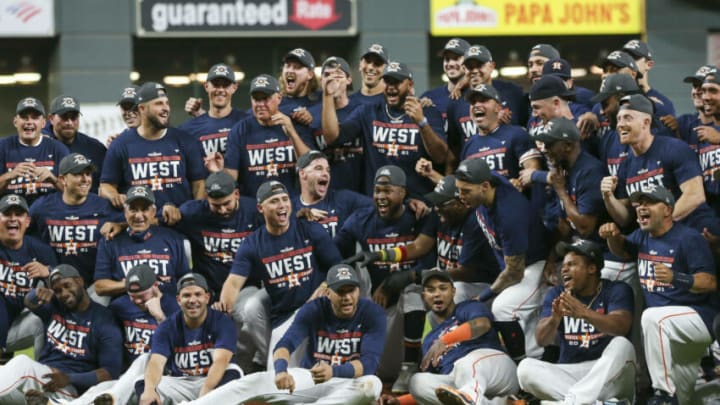 Sep 30, 2021; Houston, Texas, USA; Houston Astros players pose for a picture after after defeating the Tampa Bay Rays to clinch the American League West division at Minute Maid Park. Mandatory Credit: Troy Taormina-USA TODAY Sports