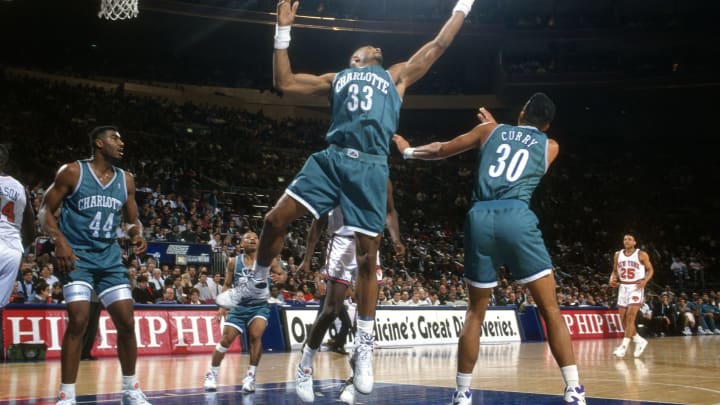 NEW YORK – CIRCA 1992: Alonzo Mourning #33 of the Charlotte Hornets grabs a rebound against the New York Knicks during an NBA basketball game circa 1992 at Madison Square Garden in the Manhattan borough of New York City. Mourning played for the Hornets from 1992-95. (Photo by Focus on Sport/Getty Images)