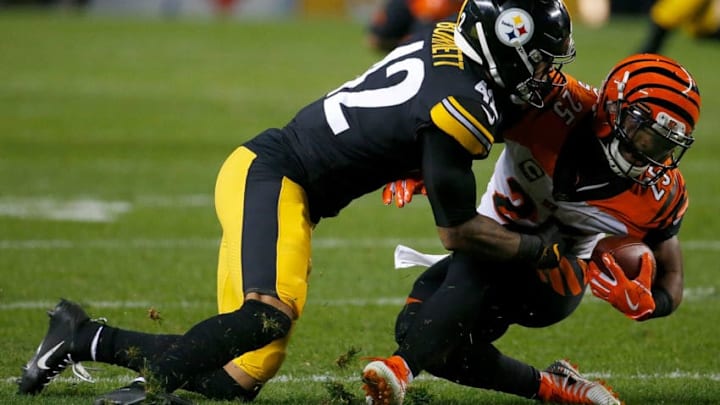 PITTSBURGH, PA - DECEMBER 30: Giovani Bernard #25 of the Cincinnati Bengals is wrapped up for a tackle by Morgan Burnett #42 of the Pittsburgh Steelers in the third quarter during the game at Heinz Field on December 30, 2018 in Pittsburgh, Pennsylvania. (Photo by Justin K. Aller/Getty Images)
