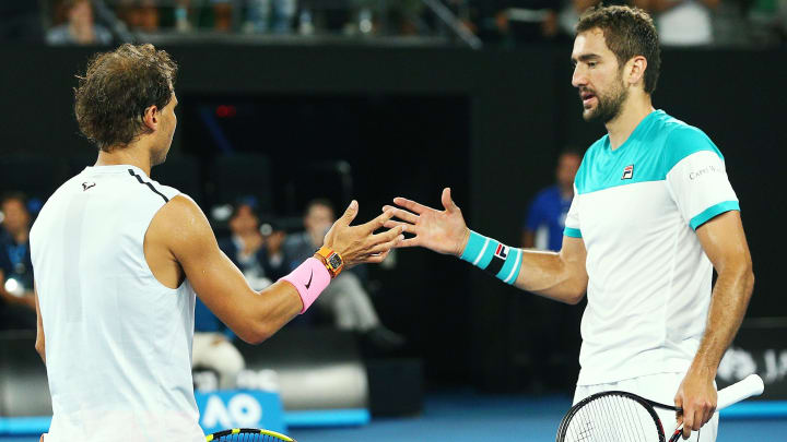 MELBOURNE, AUSTRALIA – JANUARY 23: Rafael Nadal of Spain (L) pulls out in the fifth set due to an injury in his quarter-final match against Marin Cilic of Croatia on day nine of the 2018 Australian Open at Melbourne Park on January 23, 2018 in Melbourne, Australia. (Photo by Michael Dodge/Getty Images)