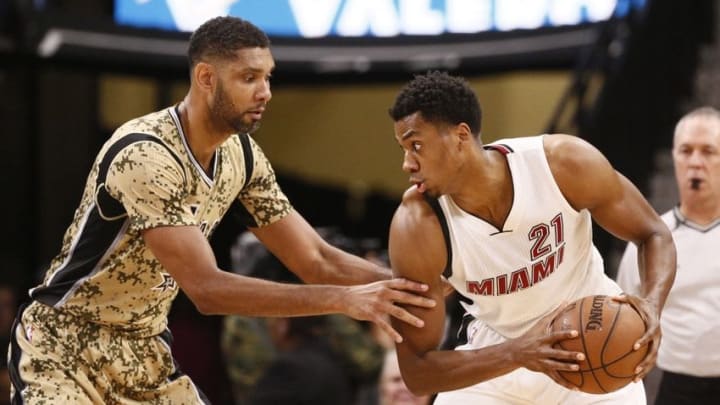 Mar 23, 2016; San Antonio, TX, USA; Miami Heat center Hassan Whiteside (21) defended by San Antonio Spurs power forward Tim Duncan (21) during the first half at AT&T Center. Mandatory Credit: Soobum Im-USA TODAY Sports