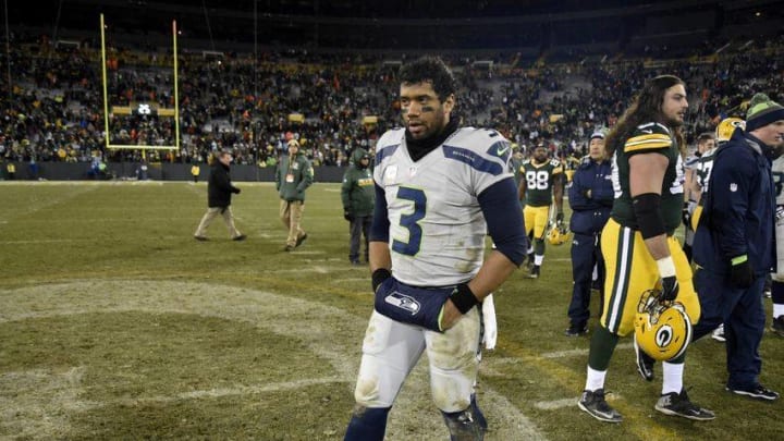 Dec 11, 2016; Green Bay, WI, USA; Seattle Seahawks quarterback Russell Wilson (3) walks off the field after the Seahawks lost to the Green Bay Packers 38-10 at Lambeau Field. Mandatory Credit: Benny Sieu-USA TODAY Sports