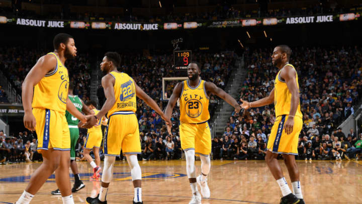 SAN FRANCISCO, CA - NOVEMBER 15: Draymond Green #23 of the Golden State Warriors hi-fives team mates during the game against the Boston Celtics on November 15, 2019 at Chase Center in San Francisco, California. NOTE TO USER: User expressly acknowledges and agrees that, by downloading and or using this photograph, user is consenting to the terms and conditions of Getty Images License Agreement. Mandatory Copyright Notice: Copyright 2019 NBAE (Photo by Noah Graham/NBAE via Getty Images)