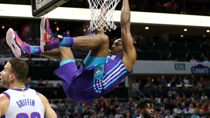 CHARLOTTE, NC - FEBRUARY 25: Blake Griffin #23 of the Detroit Pistons watches as Dwight Howard #12 of the Charlotte Hornets hangs on the rim after a dunk during their game at Spectrum Center on February 25, 2018 in Charlotte, North Carolinaka/Getty Images)