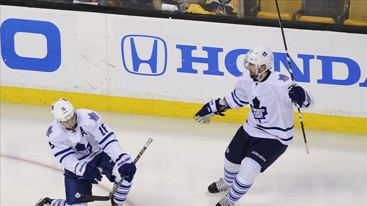 May 10, 2013; Boston, MA USA; Toronto Maple Leafs left wing Clarke MacArthur (16) (left) scores a goal during the third period in game five of the first round of the Stanley Cup Playoffs against the Boston Bruins at TD Garden. Mandatory Credit: Bob DeChiara-USA TODAY Sports