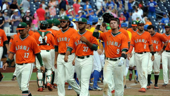 Jun 20, 2016; Omaha, NE, USA; The Miami Hurricanes walk off the field after the loss to UC Santa Barbara Gauchos in the 2016 College World Series at TD Ameritrade Park. UC Santa Barbara defeated Miami 5-3. Mandatory Credit: Steven Branscombe-USA TODAY Sports