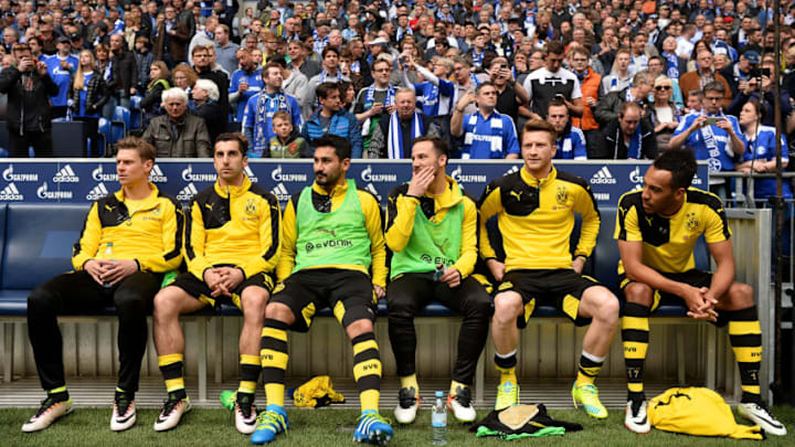 GELSENKIRCHEN, GERMANY - APRIL 10: (L-R) Lukasz Piszczek, Henrikh Mkhitaryan, Ilkay Guendogan, Gonzalo Castro, Marco Reus and Pierre-Emerick Aubameyang of Borussia Dortmund look on from the bench before the Bundesliga match between FC Schalke 04 and Borussia Dortmund at Veltins-Arena on April 10, 2016 in Gelsenkirchen, Germany. (Photo by Dennis Grombkowski/Bongarts/Getty Images)