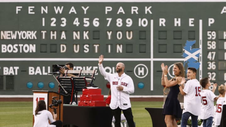 BOSTON, MA - JUNE 25: As his wife Kelli applauds, former Boston Red Sox second baseman Dustin Pedroia waves to the crowd during ceremonies honoring him before the game between the Boston Red Sox and the New York Yankees at Fenway Park on June 25, 2021 in Boston, Massachusetts. (Photo By Winslow Townson/Getty Images)