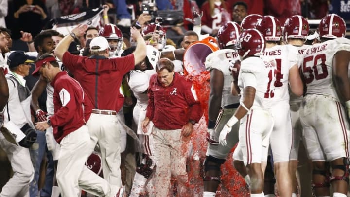 Jan 11, 2016; Glendale, AZ, USA; Alabama Crimson Tide head coach Nick Saban is dunked with Gatorade by his team members in the fourth quarter against the Clemson Tigers in the 2016 CFP National Championship at University of Phoenix Stadium. Mandatory Credit: Rob Schumacher/Arizona Republic via USA TODAY Sports