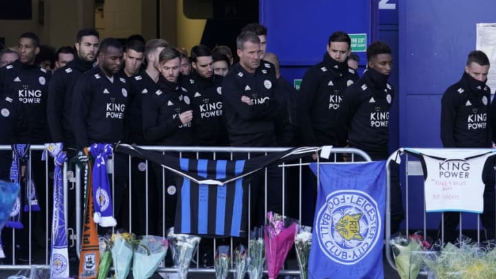 LEICESTER, ENGLAND - OCTOBER 29: Leicester City Football Club players pay their respects at the sea of tributes to the victims of the helicopter crash at Leicester City Football Club's King Power Stadium on October 28, 2018 in Leicester, England. The owner of Leicester City Football Club, Club owner Vichai Srivaddhanaprabha, was among the five people who died in the helicopter crash on Saturday evening after the club's game against West Ham. (Photo by Christopher Furlong/Getty Images)
