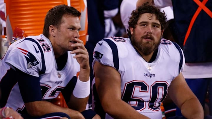 EAST RUTHERFORD, NJ - AUGUST 30: Tom Brady #12 of the New England Patriots sits with Kristjan Sokoli #60 of the New York Giants during a pre-season NFL game against the New York Giants at MetLife Stadium on August 30, 2018 in East Rutherford, New Jersey. (Photo by Jeff Zelevansky/Getty Images)