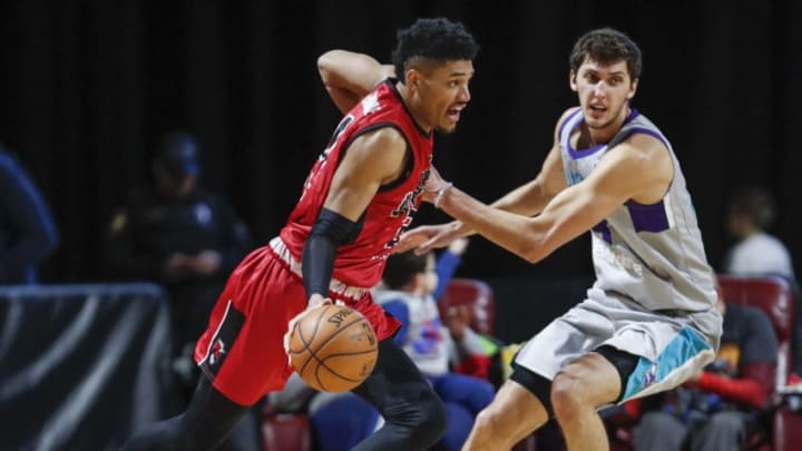 HOFFMAN ESTATES, IL - JANUARY 12: Kaiser Gates #21 of the Windy City Bulls drives to the basket against Luke Petrasek #18 of the Greensboro Swarm during the third quarter of an NBA G-League game on January 12, 2019 at Sears Centre Arena in Hoffman Estates, Illinois. NOTE TO USER: User expressly acknowledges and agrees that, by downloading and or using this photograph, User is consenting to the terms and conditions of the Getty Images License Agreement. Mandatory Copyright Notice: Copyright 2019 NBAE (Photo by Kamil Krzaczynski/NBAE via Getty Images)