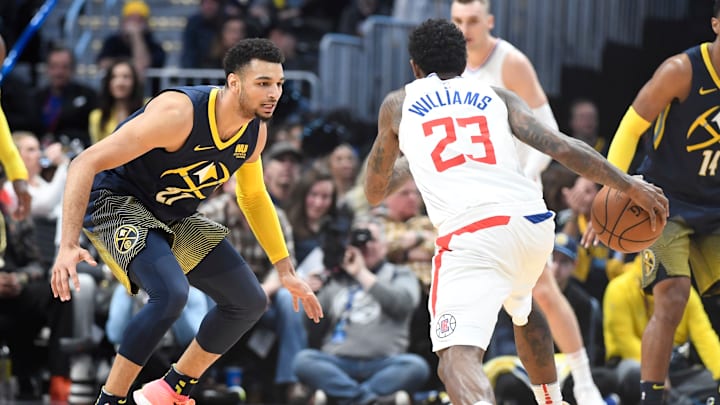 DENVER, CO – FEBRUARY 27: Jamal Murray #27 of the Denver Nuggets guards Lou Williams #23 of the LA Clippers at Pepsi Center on February 27, 2018 in Denver, Colorado. NOTE TO USER: User expressly acknowledges and agrees that, by downloading and or using this photograph, User is consenting to the terms and conditions of the Getty Images License Agreement. (Photo by Justin Tafoya/Getty Images)