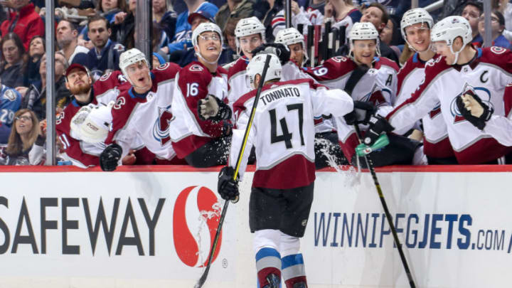 WINNIPEG, MB - FEBRUARY 14: Dominic Toninato #47 of the Colorado Avalanche gets sprayed with water as he celebrates his first career NHL goal against the Winnipeg Jets with teammates at the bench during first period action at the Bell MTS Place on February 14, 2019 in Winnipeg, Manitoba, Canada. (Photo by Jonathan Kozub/NHLI via Getty Images)