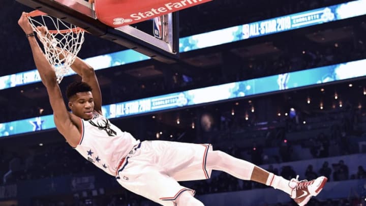 Milwaukee Bucks' Giannis Antetokounmpo swings on the rim after throwing down a two-handed dunk during the NBA All-Star Game at Spectrum Center in Charlotte, N.C. on Sunday, February 17, 2019. (Jeff Siner/Charlotte Observer/TNS via Getty Images)