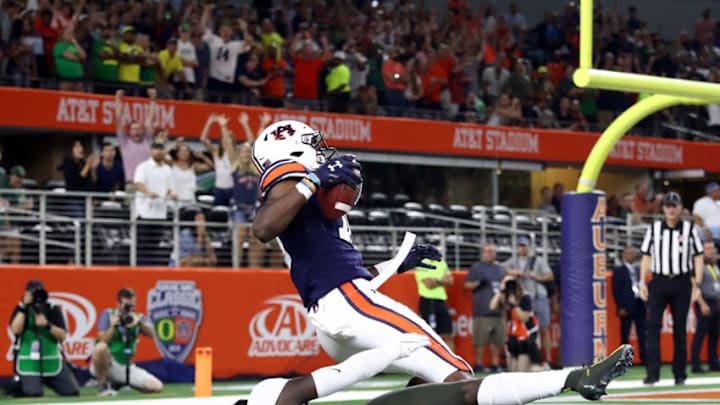 ARLINGTON, TEXAS - AUGUST 31: Seth Williams #18 of the Auburn Tigers makes the game winning touchdown pass against Verone McKinley III #23 of the Oregon Ducks in the fourth quarter during the Advocare Classic at AT&T Stadium on August 31, 2019 in Arlington, Texas. (Photo by Ronald Martinez/Getty Images)