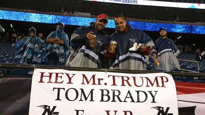 FOXBORO, MA - SEPTEMBER 10: Fans stand with a sign stating 'Hey Mr. Trump Tom Brady for V.P.' before the game between the New England Patriots and the Pittsburgh Steelers at Gillette Stadium on September 10, 2015 in Foxboro, Massachusetts. (Photo by Jim Rogash/Getty Images)