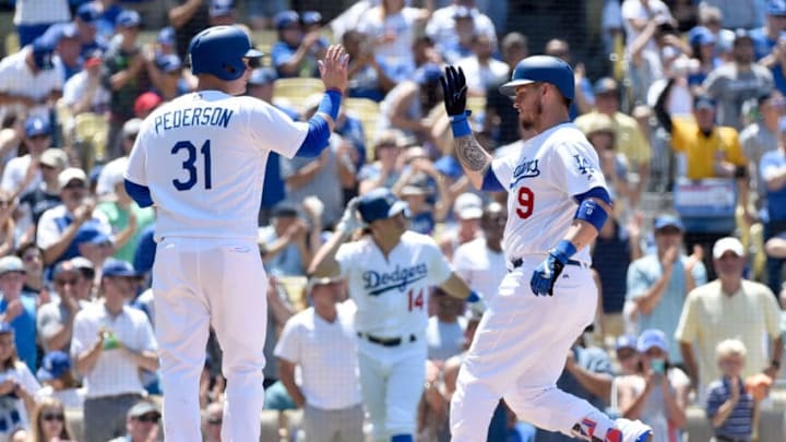 LOS ANGELES, CA - JUNE 05: Yasmani Grandal #9 of the Los Angeles Dodgers is congratulated by teammate Joc Pederson #31 after hitting a three-run home run in the third inning against the Atlanta Braves at Dodger Stadium on June 5, 2016 in Los Angeles, California. (Photo by Lisa Blumenfeld/Getty Images)