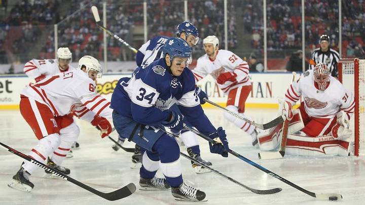 Jan 1, 2017; Toronto, Ontario, CAN; Toronto Maple Leafs center Auston Matthews (34) controls the puck against the Detroit Red Wings during the Centennial Classic ice hockey game at BMO Field. Mandatory Credit: Tom Szczerbowski-USA TODAY Sports