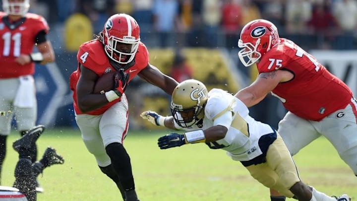 Nov 28, 2015; Atlanta, GA, USA; Georgia Bulldogs running back Keith Marshall (4) runs against Georgia Tech Yellow Jackets defensive back Jamal Golden (4) during the second half at Bobby Dodd Stadium. Georgia defeated Georgia Tech 13-7. Mandatory Credit: Dale Zanine-USA TODAY Sports Nov 28, 2015; Atlanta, GA, USA; Georgia Bulldogs running back Keith Marshall (4) runs against Georgia Tech Yellow Jackets defensive back Jamal Golden (4) during the second half at Bobby Dodd Stadium. Georgia defeated Georgia Tech 13-7. Mandatory Credit: Dale Zanine-USA TODAY Sports