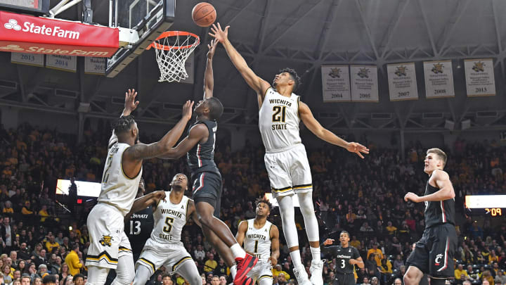 WICHITA, KS – FEBRUARY 06: Jaime Echenique #21 of the Wichita State Shockers blocks the shot attempt of Mika Adams-Woods #3 of the Cincinnati Bearcats during the second half at Charles Koch Arena on February 6, 2020 in Wichita, Kansas. (Photo by Peter G. Aiken/Getty Images)