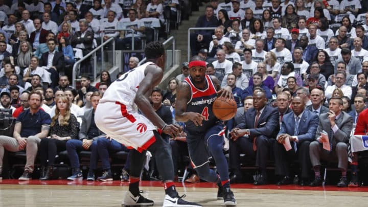 TORONTO, CANADA - APRIL 17: Ty Lawson #4 of the Washington Wizards handles the ball against the Toronto Raptors in Game Two of Round One of the 2018 NBA Playoffs on April 17, 2018 at the Air Canada Centre in Toronto, Ontario, Canada. NOTE TO USER: User expressly acknowledges and agrees that, by downloading and or using this Photograph, user is consenting to the terms and conditions of the Getty Images License Agreement. Mandatory Copyright Notice: Copyright 2018 NBAE (Photo by Mark Blinch/NBAE via Getty Images)