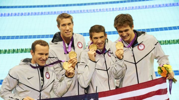 Swimming: 2012 Summer Olympics: (L-R) Closeup of Team USA Brendan Hansen, Matthew Grevers, Michael Phelps, and Nathan Adrian victorious with gold medals after Men's 4x100M Medley Relay Final at Aquatics Centre.London, United Kingdom 8/4/2012CREDIT: Heinz Kluetmeier (Photo by Heinz Kluetmeier /Sports Illustrated/Getty Images)(Set Number: X155231 TK6 R1 F137 )