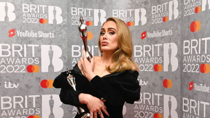 LONDON, ENGLAND - FEBRUARY 08: (EDITORIAL USE ONLY) Adele poses with her award in the media room during The BRIT Awards 2022 at The O2 Arena on February 08, 2022 in London, England. (Photo by Kate Green/Getty Images )