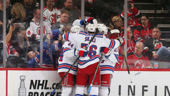 NEWARK, NJ - APRIL 01: Members of the New York Rangers celebrate a first period goal by teammate Brett Howden #21 against the New Jersey Devils at the Prudential Center on April 1, 2019 in Newark, New Jersey. (Photo by Andy Marlin/NHLI via Getty Images)