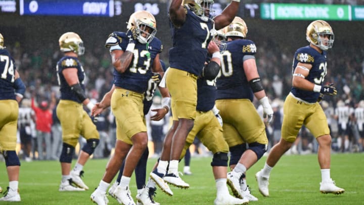 Aug 26, 2023; Dublin, IRL; Notre Dame Fighting Irish running back Audric Estime (7) celebrates after a first quarter touchdown against the Navy Midshipmen at Aviva Stadium. Mandatory Credit: Matt Cashore-USA TODAY Sports