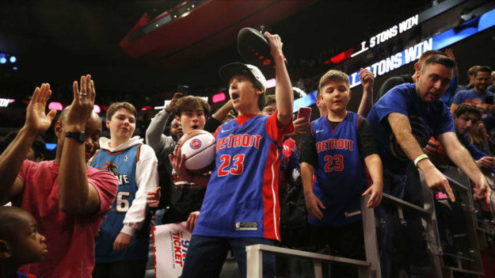 DETROIT, MI - DECEMBER 26: A young fan reacts after getting the sneakers of Blake Griffin #23 of the Detroit Pistons after a game against the Washington Wizards on December 26, 2019 at Little Caesars Arena in Detroit, Michigan. NOTE TO USER: User expressly acknowledges and agrees that, by downloading and/or using this photograph, User is consenting to the terms and conditions of the Getty Images License Agreement. Mandatory Copyright Notice: Copyright 2019 NBAE (Photo by Brian Sevald/NBAE via Getty Images)