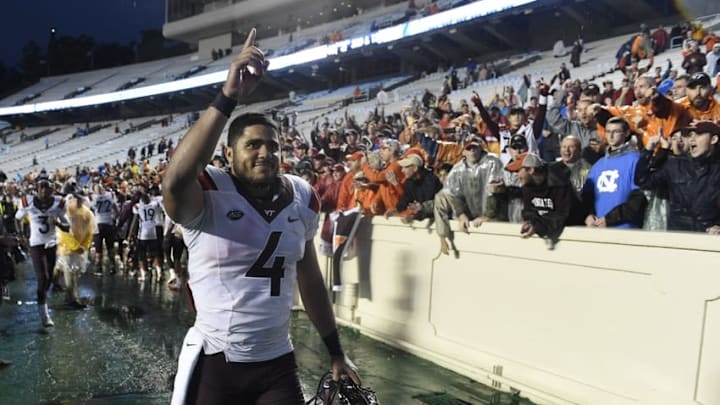 Oct 8, 2016; Chapel Hill, NC, USA; Virginia Tech Hokies quarterback Jerod Evans (4) celebrates after the game. The Hokies defeated the Tar Heels 34-3 at Kenan Memorial Stadium. Mandatory Credit: Bob Donnan-USA TODAY Sports