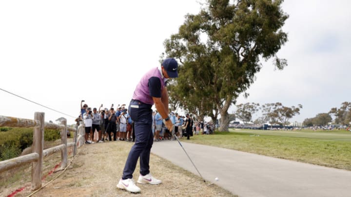 SAN DIEGO, CALIFORNIA - JUNE 19: Rory McIlroy of Northern Ireland hits an approach shot after taking a drop on the 15th hole during the third round of the 2021 U.S. Open at Torrey Pines Golf Course (South Course) on June 19, 2021 in San Diego, California. (Photo by Ezra Shaw/Getty Images)