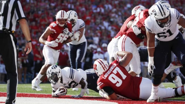 MADISON, WI - SEPTEMBER 15: Squally Canada #22 of the BYU Cougars dives into the end zone for a two-yard touchdown in the third quarter of the game against the Wisconsin Badgers at Camp Randall Stadium on September 15, 2018 in Madison, Wisconsin. BYU won 24-21. (Photo by Joe Robbins/Getty Images)