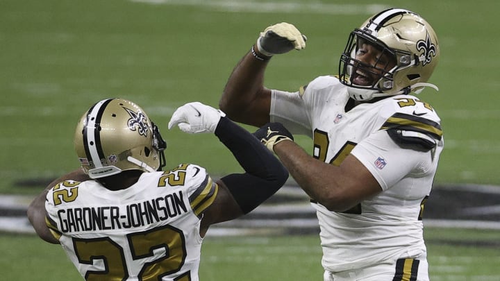 NEW ORLEANS, LOUISIANA – DECEMBER 25: Cameron Jordan #94, right, and Chauncey Gardner-Johnson #22 of the New Orleans Saints celebrate a play during the fourth quarter against the Minnesota Vikings at Mercedes-Benz Superdome on December 25, 2020 in New Orleans, Louisiana. (Photo by Chris Graythen/Getty Images)