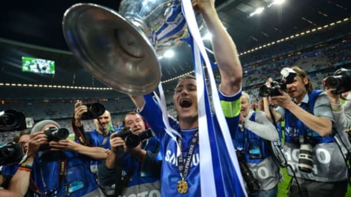 Chelsea's British midfielder Frank Lampard holds the trophy after the UEFA Champions League final football match between FC Bayern Muenchen and Chelsea FC on May 19, 2012 at the Fussball Arena stadium in Munich. Chelsea won 4-3 in the penalty phase. AFP PHOTO / ADRIAN DENNIS (Photo credit should read ADRIAN DENNIS/AFP/GettyImages)