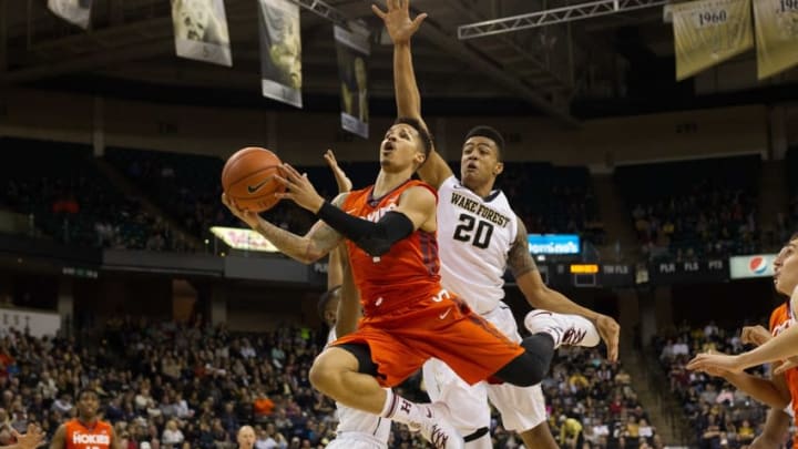 Feb 28, 2016; Winston-Salem, NC, USA; Virginia Tech Hokies guard Seth Allen (4) goes up for a shot against Wake Forest Demon Deacons forward John Collins (20) in the second half at Lawrence Joel Veterans Memorial Coliseum. Virginia Tech defeated Wake Forest 81-74. Mandatory Credit: Jeremy Brevard-USA TODAY Sports