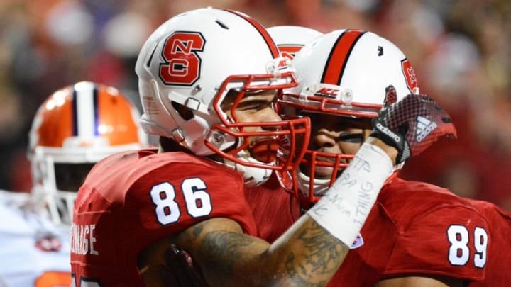 Oct 31, 2015; Raleigh, NC, USA; North Carolina State Wolfpack tight end David Grinnage (86) is congratulated by teammate Benson Browne (89) after scoring a touchdown during the second half against the Clemson Tigers at Carter Finley Stadium. Clemson won 56-41. Mandatory Credit: Rob Kinnan-USA TODAY Sports