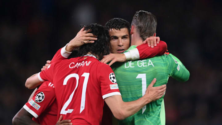 MANCHESTER, ENGLAND - SEPTEMBER 29: Cristiano Ronaldo of Manchester United celebrates their side's victory with Edinson Cavani and David De Gea after the UEFA Champions League group F match between Manchester United and Villarreal CF at Old Trafford on September 29, 2021 in Manchester, England. (Photo by Laurence Griffiths/Getty Images)