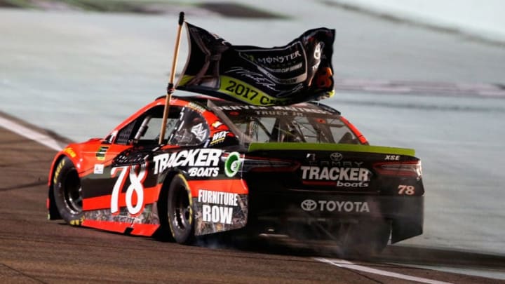 HOMESTEAD, FL - NOVEMBER 19: Martin Truex Jr., driver of the #78 Bass Pro Shops/Tracker Boats Toyota, celebrates after winning the Monster Energy NASCAR Cup Series Championship and the Monster Energy NASCAR Cup Series Championship Ford EcoBoost 400 at Homestead-Miami Speedway on November 19, 2017 in Homestead, Florida. (Photo by Brian Lawdermilk/Getty Images)