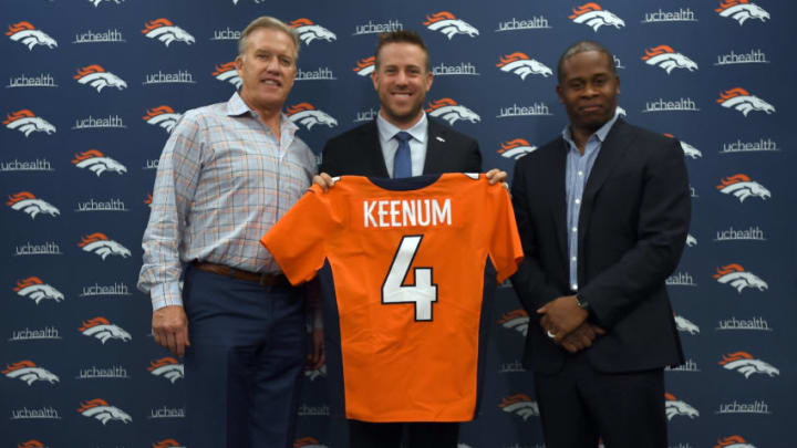 ENGLEWOOD, CO MARCH 16: John Elway, general manager and executive vice president of football operations of the Denver Broncos and head coach Vance Joseph present quarterback Case Keenum with his jersey with the no.4 on it during a press conference on March 16, 2018 at Dove Valley. Case Keenum agreed to terms on a two-year deal with the Denver Broncos. (Photo by John Leyba/The Denver Post via Getty Images)