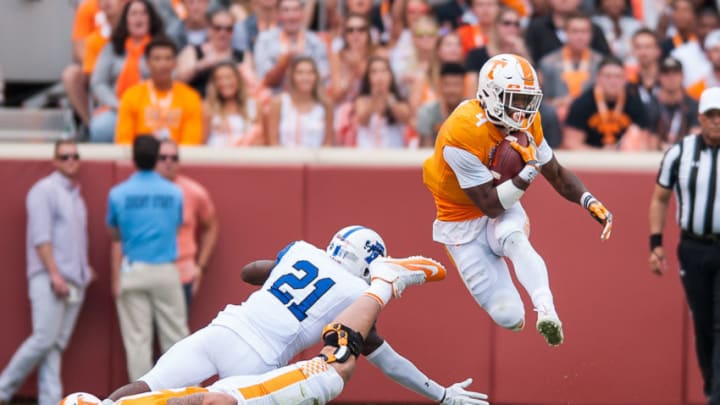 KNOXVILLE, TN - SEPTEMBER 09: Tennessee Volunteers running back John Kelly (4) jumps over Indiana State Sycamores safety De'Jaun Tyson (21) during a game between the Indiana State Sycamores and Tennessee Volunteers on September 9, 2017, at Neyland Stadium in Knoxville, TN. (Photo by Bryan Lynn/Icon Sportswire via Getty Images)