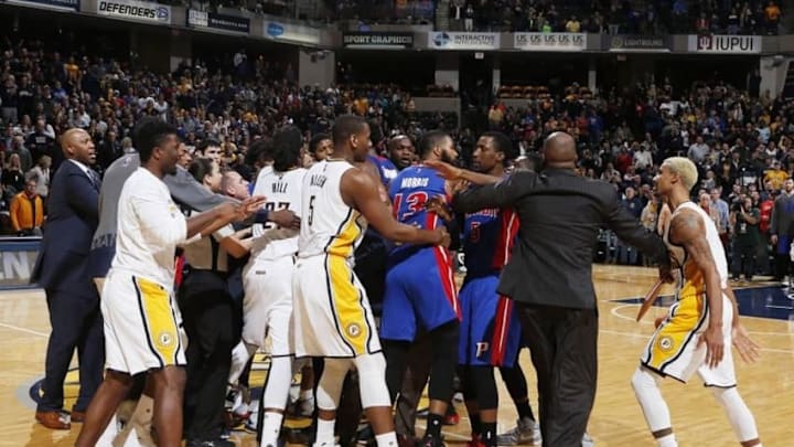 Jan 2, 2016; Indianapolis, IN, USA; Referees and coaches try to separate the Indiana Pacers and the Detroit Pistons as they get into an altercation at the end of the game at Bankers Life Fieldhouse. Indiana defeats Detroit 94-82. Mandatory Credit: Brian Spurlock-USA TODAY Sports